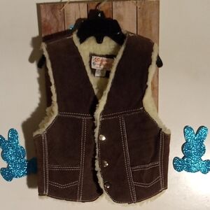 Little boy's leather and sheep skin vest. Not saying it's real. Not sure.